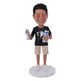 Custom Bobblehead holding Clase Azul reposado tequila bottle