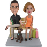 Couple Bobbleheads Sitting on Bench with Dog