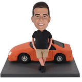 Customized Bobblehead Leaning Against Car